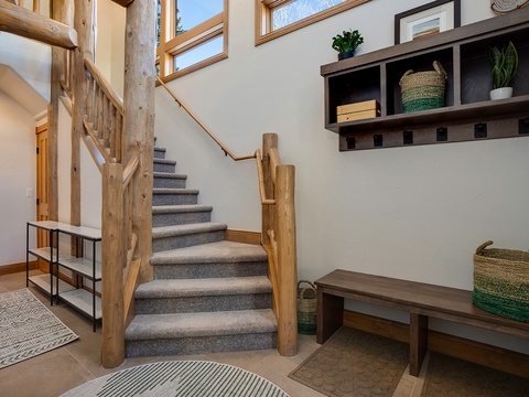 Step into your mountain escape—where rustic log beams and thoughtful storage blend perfectly with bright, airy windows and natural light.