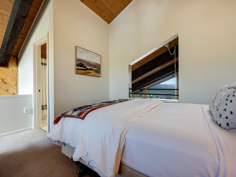 Sink into crisp linens under vaulted wood ceilings and wake to mountain views framed through your bedroom window.