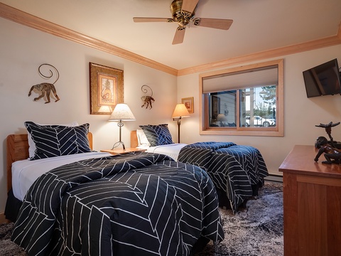 Drift into restful sleep in your cozy bedroom, where plush twin beds, charming decor, and a peaceful ambiance await. The natural light and modern amenities create your perfect retreat.