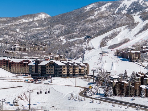 A stunning ski-in/ski-out mountain resort set against pristine slopes and spectacular alpine scenery, offering direct access to winter adventures and breathtaking mountain vistas.