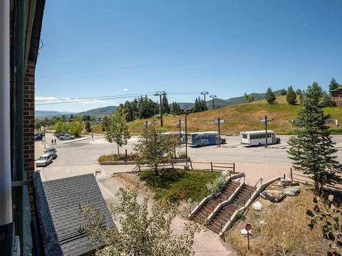 Elevated views of the surrounding town and mountain landscape showcase the property's central location near parking, transit, and outdoor recreation.