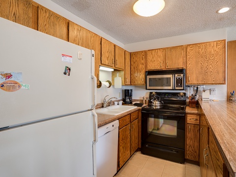 Your fully equipped kitchen has everything you need: a spacious refrigerator, stove with oven, microwave, dishwasher, and plenty of counter space to prepare your favorite meals during your stay.