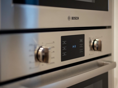 Premium Bosch wall oven with sleek stainless steel finish and digital controls awaits your culinary creations.
