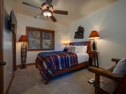 Step into your cozy retreat with rustic charm—plush bedding, warm lamps, and mountain-inspired décor create the perfect space to unwind after a day of adventure.