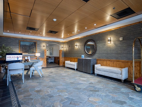A modern lobby welcomes you with warm wood accents, elegant lighting, and comfortable seating areas for relaxing while you check in.