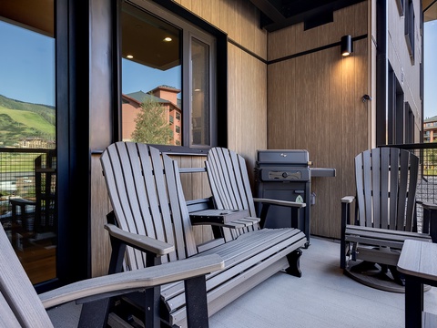 Settle into your private balcony with Adirondack-style seating and a personal gas grill, where mountain vistas stretch across the horizon and fresh alpine air invites you to unwind after a day of adventure.