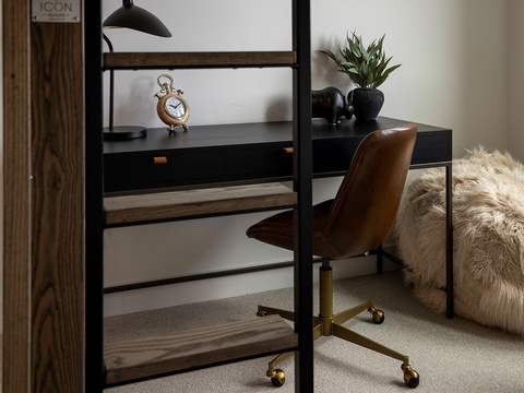 Your dedicated workspace features a sleek desk, stylish leather chair, and curated décor—perfect for staying productive or catching up on plans during your stay.