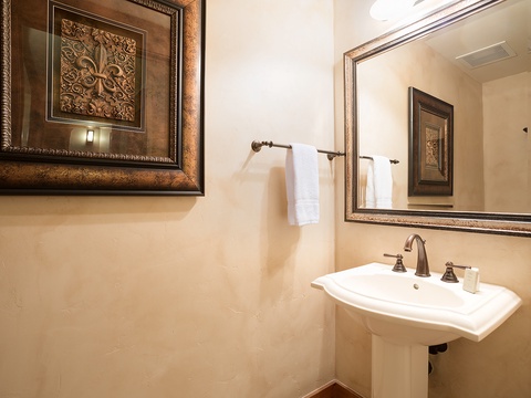 Elegant powder room with crisp linens and refined finishes—perfect for freshening up after your day's adventures.