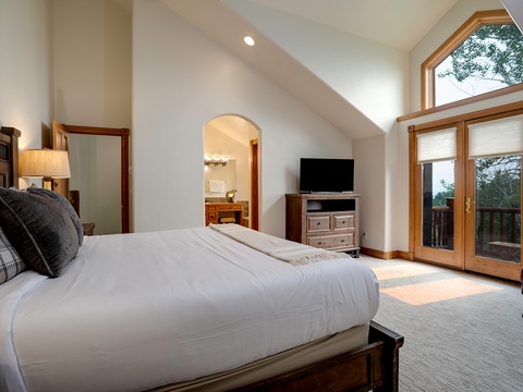 Sunlight fills your serene retreat with vaulted ceilings and warm wood accents. Step onto your private balcony to breathe in fresh mountain air and unwind after a day of adventure.