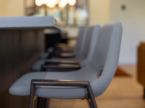 Gather around this sleek dining table where your group can share memorable meals together in contemporary comfort.