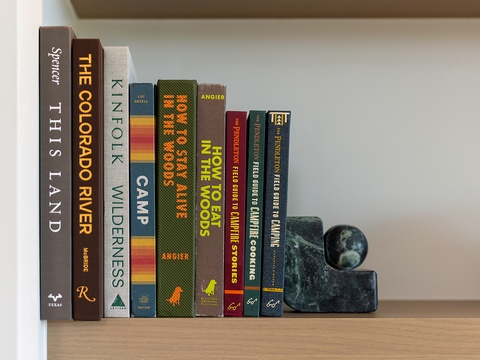 A carefully curated collection awaits your quiet reading moments, inviting you to unwind with a good book in the calm of your rental space.