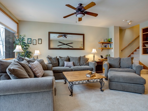 Unwind in your spacious living room with plush seating for the whole family. Ceiling fan and natural light create a bright, airy retreat after exploring the area.
