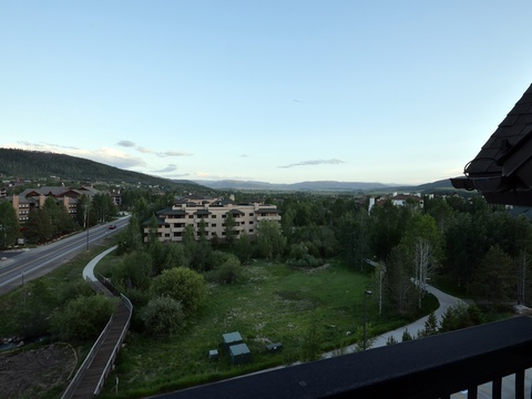 Mountain resort area surrounded by lush forests and winding roads, offering a peaceful retreat in nature's embrace.
