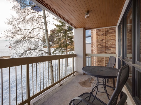 Sip your morning coffee from your private balcony as snow blankets the slopes below, framing the mountain escape just beyond your door.