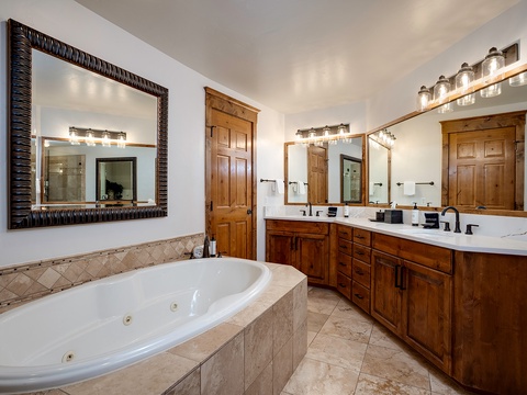 Soak in your spa-like retreat with a jetted tub, dual vanities, and elegant woodwork—perfect for unwinding after a mountain adventure.