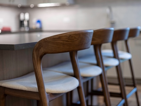 Pull up a seat at your sleek kitchen island and savor the blend of modern design and natural warmth that makes every meal feel special.