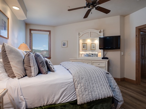 Your serene retreat features crisp linens, plush pillows, a ceiling fan for comfort, and thoughtful touches like warm lighting and coastal décor to help you unwind completely.