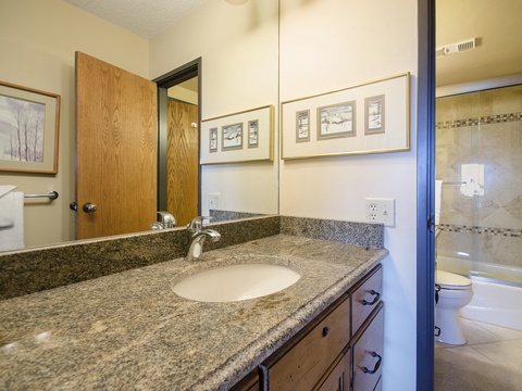 Freshen up in your spacious bathroom with granite counters, a walk-in shower, and thoughtful amenities—everything you need to feel right at home during your stay.
