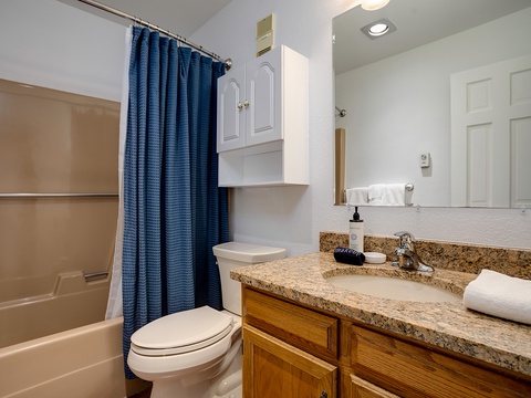 Your private bathroom features a fresh, clean design with a granite vanity, spacious tub/shower combo, and all the essentials for a comfortable stay.