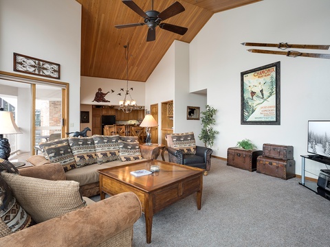Unwind in your cozy alpine retreat with soaring ceilings, rustic charm, and mountain-inspired décor that invites you to relax after your adventures.