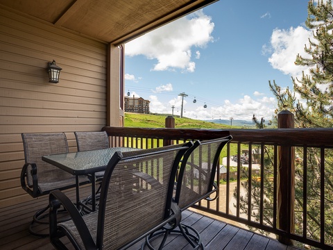 Step onto your private balcony and savor morning coffee with breathtaking mountain vistas, fresh alpine air, and rolling green slopes stretching beyond the railing.