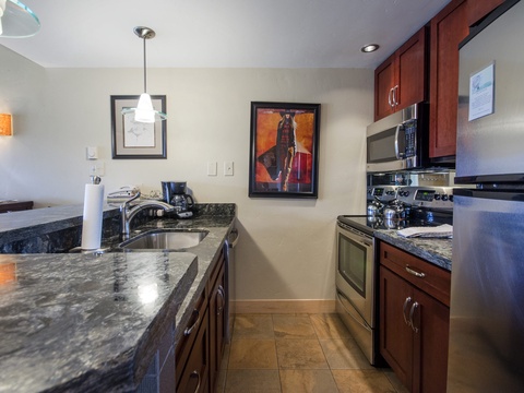 Your fully equipped kitchen features granite countertops, stainless steel appliances, and everything you need to prepare delicious meals during your stay.