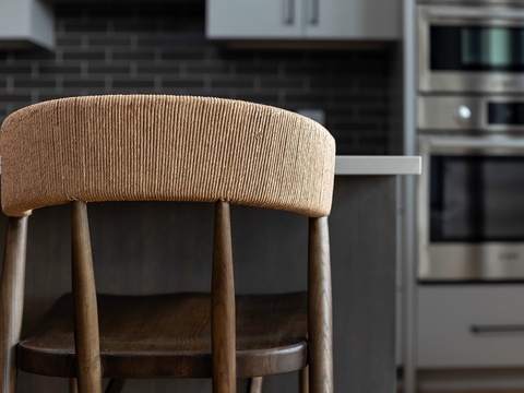 Settle into your modern chef's kitchen with designer seating and stainless steel appliances ready for your culinary adventures.