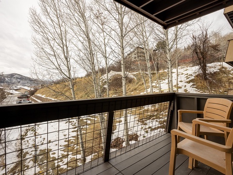 A private balcony offering serene mountain and winter landscape views, perfect for your morning coffee or evening relaxation in the crisp mountain air.