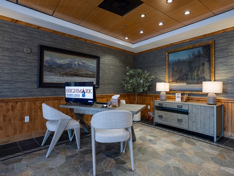 The lobby greets you with warm wood accents, mountain landscapes, and a welcoming desk where your vacation begins. Relax in modern seating as you arrive to your mountain retreat.