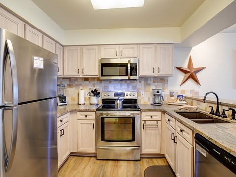 Your fully-equipped kitchen features granite countertops, stainless steel appliances, and everything you need to prepare delicious home-cooked meals during your stay.