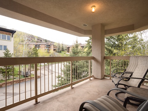 Relax on your private balcony with comfortable lounge chairs, where you can unwind surrounded by peaceful neighborhood views and fresh mountain air.
