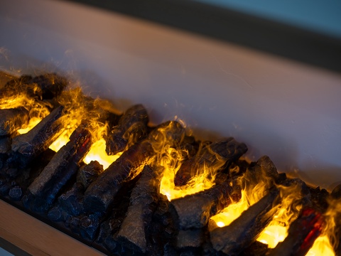 Stay cozy during your getaway with the inviting warmth of a modern fireplace, creating the perfect ambiance for relaxing evenings at home.