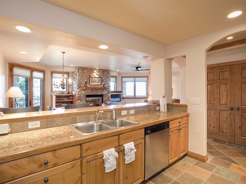 Step into your open kitchen with gleaming granite counters, where you'll find everything you need to prepare meals while staying connected to the cozy living space beyond.
