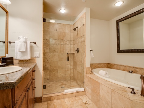 Unwind in your spa-like bathroom with a walk-in shower and a jetted soaking tub—your private retreat after a day of adventure.