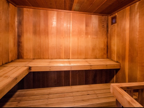 Step into this warm wooden sauna and let the gentle heat melt away your stress. Two levels of smooth benches invite you to relax in peaceful comfort.