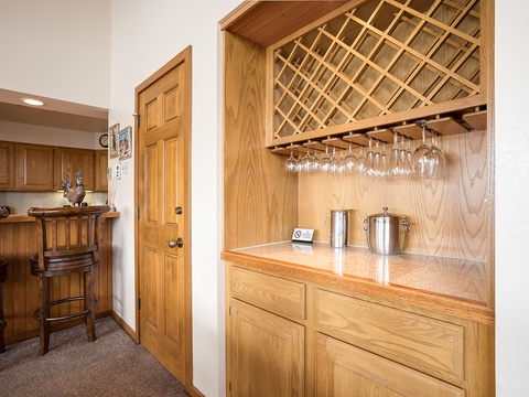 Your own stylish wet bar with wine storage and stemware rack awaits—perfect for unwinding after a day of adventure or hosting a cozy evening in.