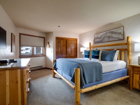 Sink into your cozy retreat where rustic wooden accents meet modern comfort. Crisp linens, plush textured throws, and soft lighting create your perfect mountain hideaway.