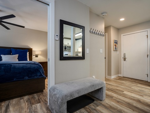 Step into your private retreat where warm wood floors guide you to a plush bedroom sanctuary. Hang your coat, settle in, and feel instantly at home.