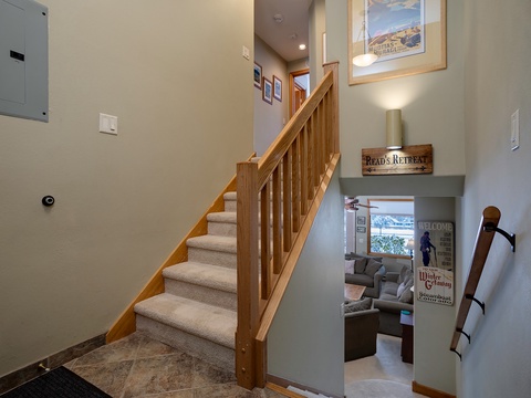 Step into Read's Retreat, where warm wood details and cozy touches immediately make you feel at home—your mountain escape awaits just beyond.