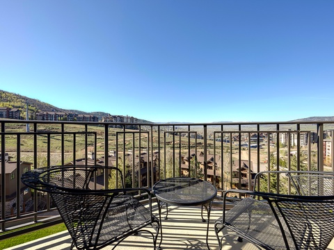 A mountain resort community extends across the landscape, showcasing the property's scenic hillside location and surrounding development.