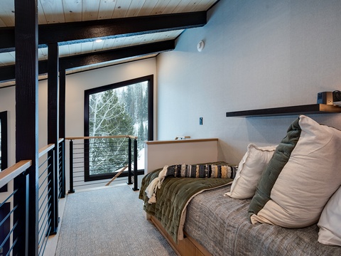 Cozy up in your thoughtfully designed bedroom with vaulted wood ceilings, modern accents, and forest views that bring nature right to your window.