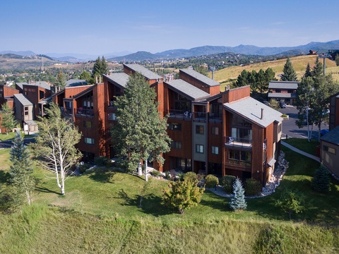 This mountain-side property sits amid scenic rolling hills and evergreen trees, offering a peaceful alpine setting with convenient access to nearby recreational areas.
