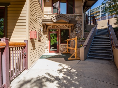 Welcoming stone and wood-accented entrance with accessible pathways and convenient access to the surrounding mountain community.