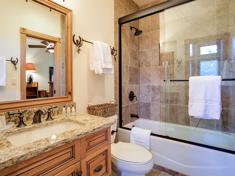 Relax in your beautifully appointed bathroom with granite countertops, rustic fixtures, and a spa-inspired tub-shower combo. Plush towels and thoughtful details ensure your comfort after a day exploring the mountains.