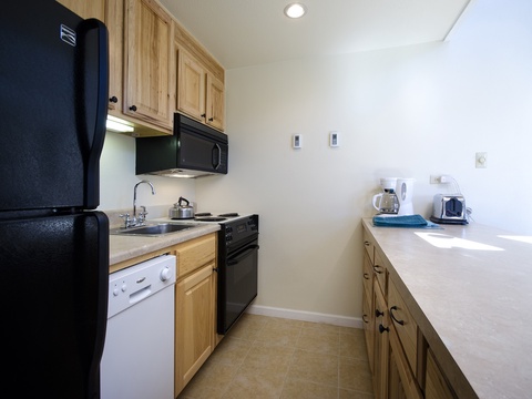 Your fully equipped kitchenette offers everything you need to prepare meals during your stay, with modern appliances, ample counter space, and natural light streaming in to make cooking feel effortless.