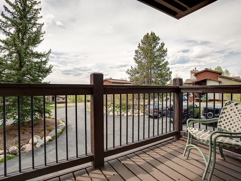 Step onto your private balcony, complete with comfortable seating and a peaceful view overlooking the surrounding neighborhood and tree-lined streets—a perfect spot to start your morning coffee.