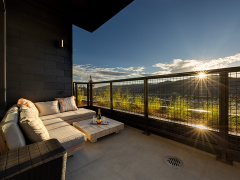Step onto your private terrace where the mountains frame the horizon and golden light spills across the landscape. Sink into the plush outdoor seating with a drink in hand and let the breathtaking scenery wash over you.
