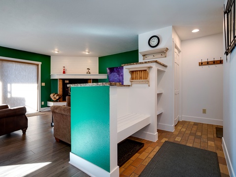 Step inside your bright, open-concept retreat featuring vibrant turquoise accents, warm wood floors, and inviting living spaces designed for relaxation and memorable moments.