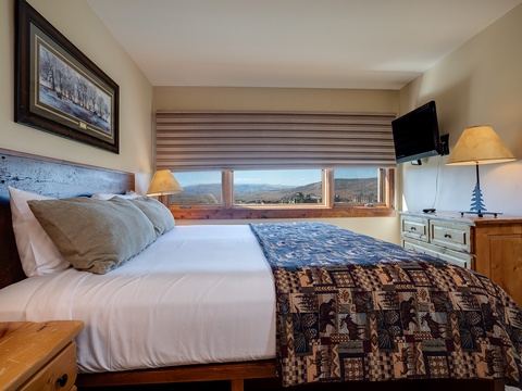 Wake up to stunning mountain views from your cozy bedroom. Crisp linens, warm wood tones, and peaceful scenery create the perfect retreat after your adventures.