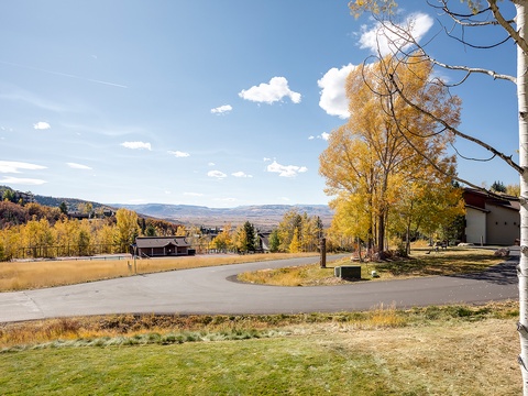 Nestled in a serene mountain community with vibrant fall foliage, this property offers a peaceful retreat surrounded by nature's seasonal beauty and sweeping valley views.